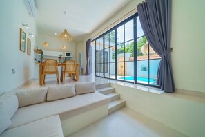 Deluxe Villa | Living area | 43-inch Smart TV with satellite channels - Villa Selina (Canggu)