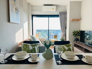 Superior Condo, 1 Bedroom, Balcony, City View | Living area | 40-inch flat-screen TV with digital channels, TV - Astra Sky River Chiang Mai By Fang (Chiang Mai)