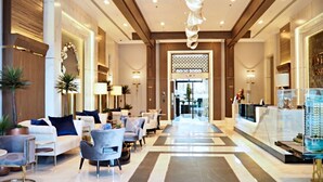 A spacious lobby with a central seating area, a reception desk, and a decorative ceiling feature. - Astra Sky River Chiang Mai By Fang (Chiang Mai)