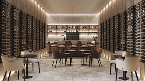 A wine cellar with rows of wine racks, a bar area, and seating arrangements. - Salento Winery Lodge - Your Wellness Oasis in Salento (San Pietro In Bevagna)