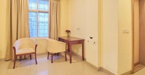 Family Suite, 1 Queen Bed, Non Smoking, City View | Desk, laptop workspace, blackout drapes, soundproofing - Tea pavilion (Bengaluru)