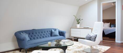 Deluxe Apartment | Living area | 55-inch Smart TV with cable channels, Netflix, streaming services