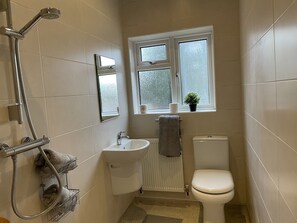 Shower, hair dryer, towels, soap