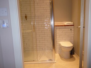 Shower, rainfall showerhead, towels