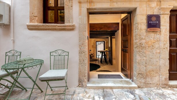 A stone building with a sign reading "ONIROS." - Oniros Residenza Vecchia  (Chania)