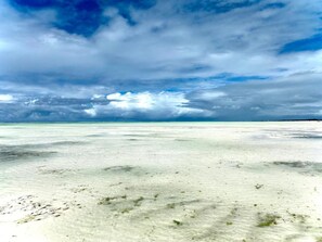 Beach nearby, white sand, sun loungers, beach umbrellas
