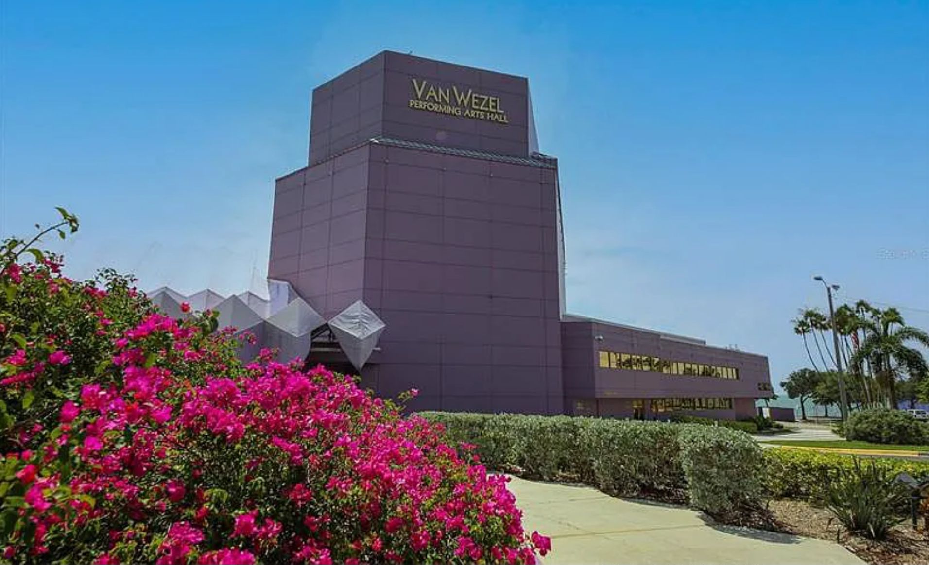 A modern building with a prominent sign reading "Van Wezel Performing Arts Hall".