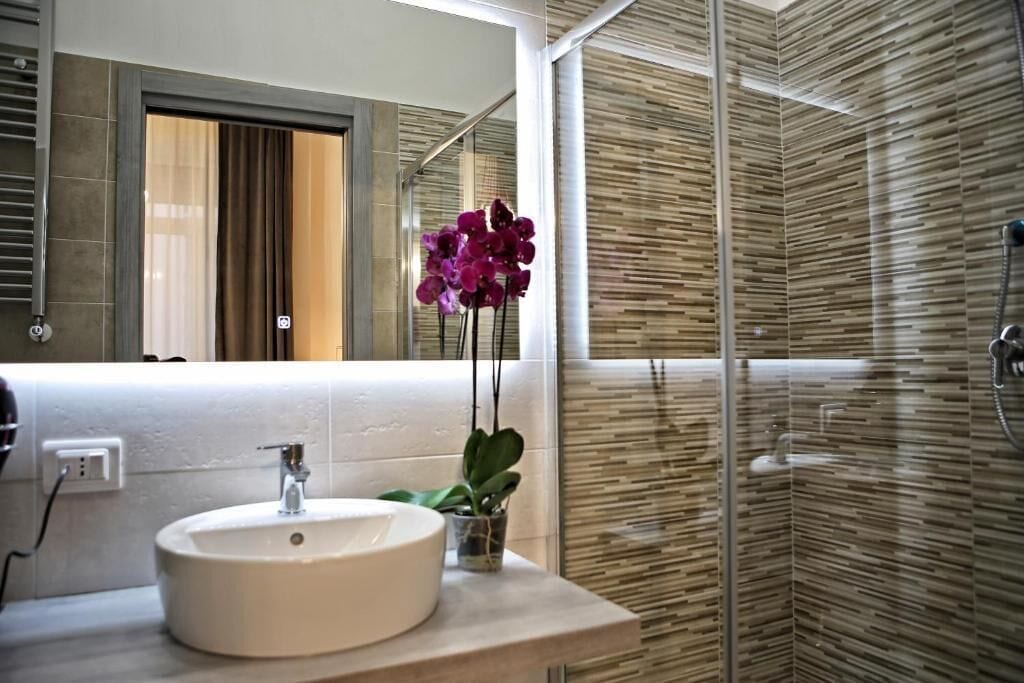 Deluxe Double Room, Courtyard View (3) | Bathroom | Shower, hair dryer, towels, soap