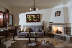 Petra Three Bedroom Luxury Suite | Living area | 45-inch flat-screen TV with cable channels