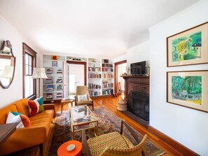 TV, fireplace, books, offices