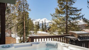 A hot tub with a mountain view, a barbecue grill, and a wooden deck. - Views! Private 4 Bedroom Home with Private Hot Tub!!! (Breckenridge)