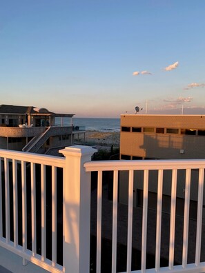 Enjoy breathtaking ocean views from the balcony with white balustrades.