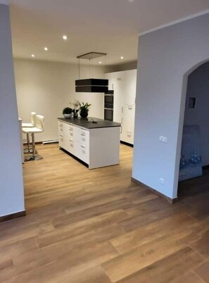 Enjoy cooking in this well-equipped kitchen with a central island and overhead hood.