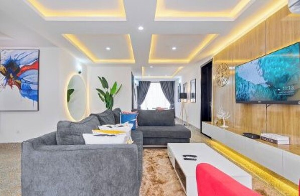 Executive Apartment | Living area | 55-inch Smart TV with digital channels, TV, fireplace - Tokyo Apartments  (Abuja)