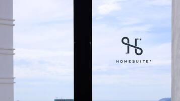 Family Studio, 1 Queen Bed with Sofa bed, Sea View | Living area | 32-inch Smart TV with digital channels, Netflix, streaming services