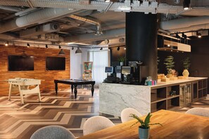 A modern interior with a pool table, bar area, and seating. - Van der Valk Hotel Paris CDG Airport (Roissy-en-France)