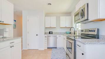 Fridge, coffee/tea maker, cookware/dishes/utensils