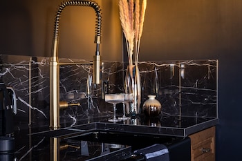 The Two-Story Irving Gill Penthouse | Bathroom | Free toiletries, hair dryer, bathrobes, slippers at Orli La Jolla