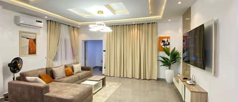 Luxury Apartment | Living area | 65-inch Smart TV with digital channels, TV, Netflix