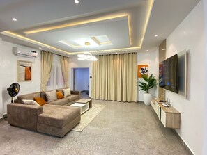 Luxury Apartment | Living area | 65-inch Smart TV with digital channels, TV, Netflix