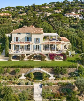 A large two-story house with multiple balconies, a stone bridge, and a well-maintained garden. - Le Belvedere - Nine Bedroom Villa, Sleeps 22 (Sainte-Maxime)