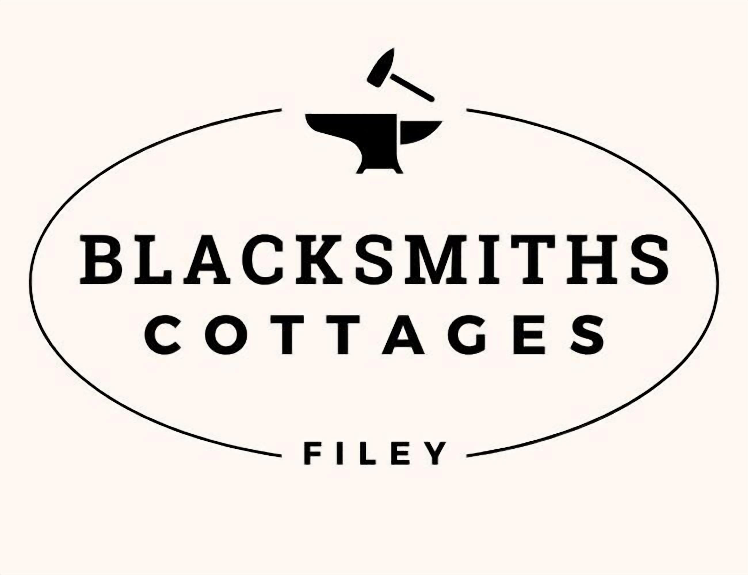 A logo with the text "BLACKSMITHS COTTAGES FILEY".