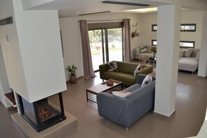 Villa | Living area | Fireplace