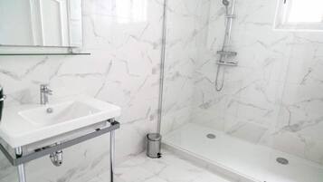 Shower, rainfall showerhead, hair dryer, towels