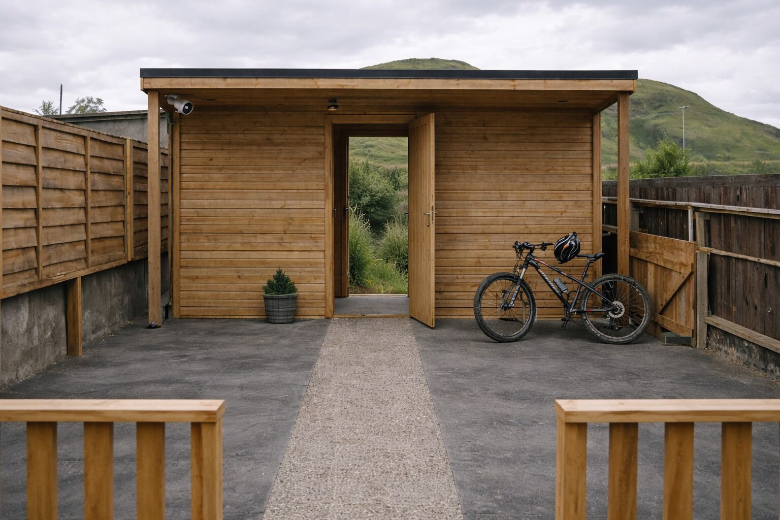 CCTV , electric power points for charging e-bikes, bike stands, hooks for hanging helmets and coats plus a dartboard.