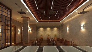 A modern spa with multiple tubs, wooden ceiling panels, and wall-mounted lighting. -  Quynh Trang Hung Yen Hotel (Nhu Quynh)