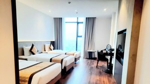 A hotel room with two beds, a desk, and a large window. -  Quynh Trang Hung Yen Hotel (Nhu Quynh)