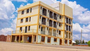 A multi-story building with balconies and a flat roof. - Budget Double Room at Sabunyo Hotel Sironko (Sironko)