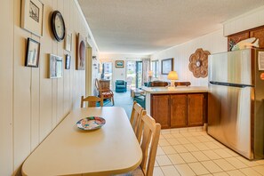 Enjoy meal preparation and dining in this well-organized kitchen with a central island and dining table.