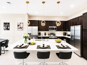 Coffee/tea maker, fridge, microwave, oven