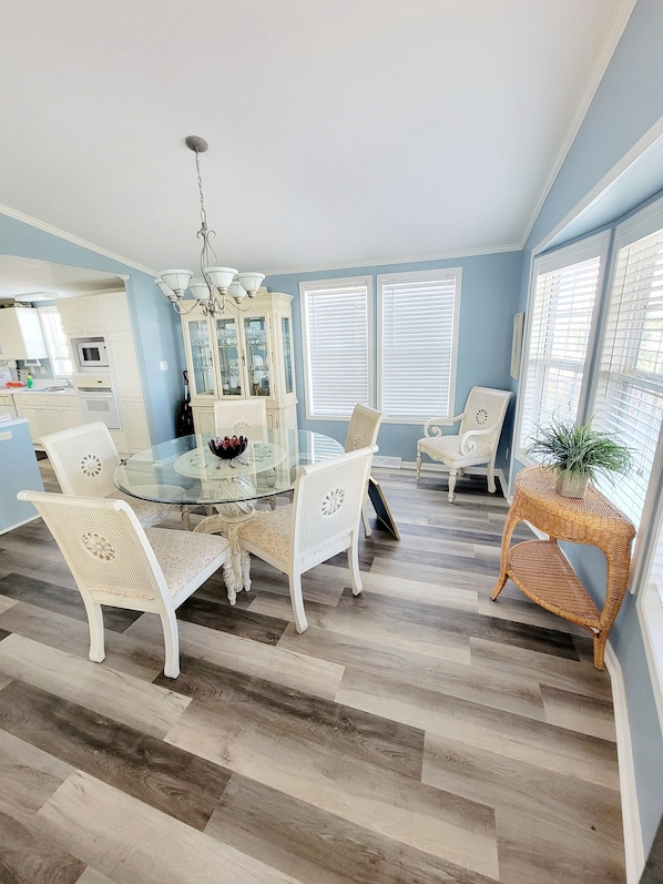 Enjoy meals in this stylish dining area with a round table and comfortable chairs.