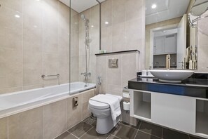 Bathtub, hair dryer, towels, soap