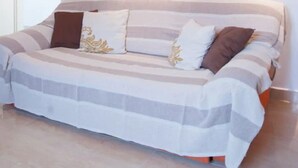 A bedroom with a bed, a painting on the wall, and a door. - Apartments Paula - One Bedroom Apartment with Terrace 2 (Jezera)