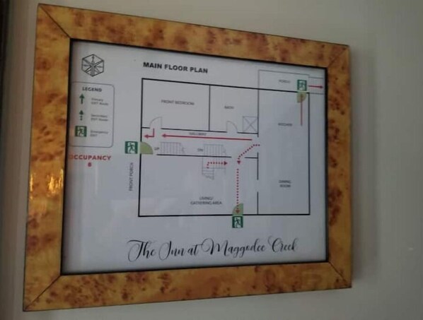A main floor plan of The Inn at Maggodee Creek, including a lobby, dining area, and guest rooms.
