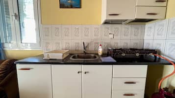 Fridge, electric kettle, toaster, cookware/dishes/utensils