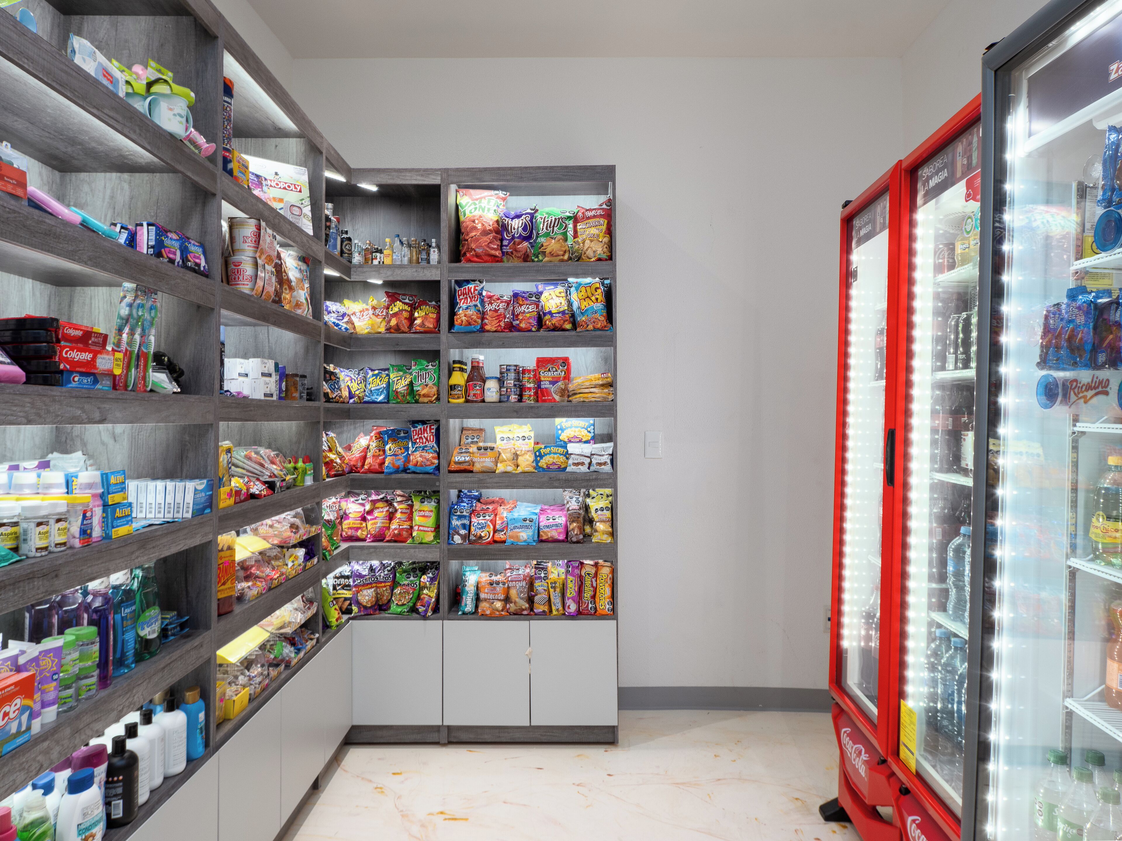 A snack and beverage vending area with various snacks and drinks.