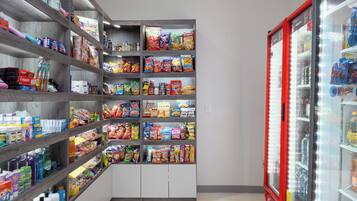 A snack and beverage vending area with various snacks and drinks.