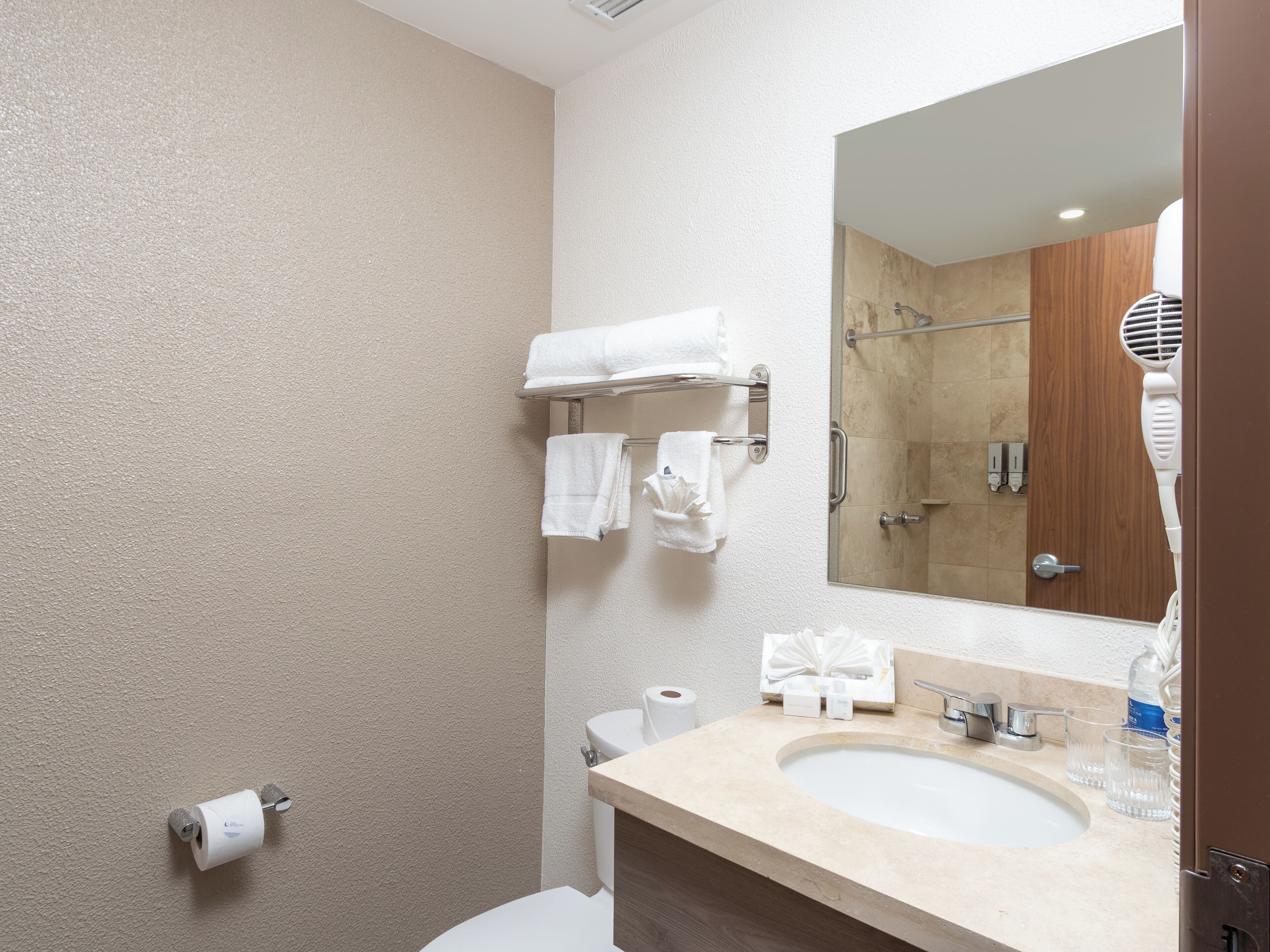 family studio suite | bathroom | shower, rainfall showerhead, hair dryer, towels
