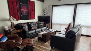 A living room with a sofa, armchairs, a coffee table, and a TV. - Dreamcatcher - 2 bed 2 bath condo with tremdous views! (Estes Park)