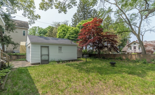 A small, single-story house with a front door and a small porch.