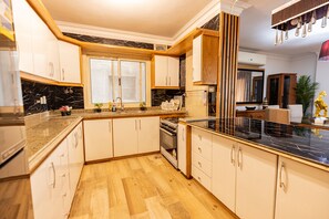 Comfort Apartment | Private kitchen | Full-sized fridge, microwave, oven, dishwasher