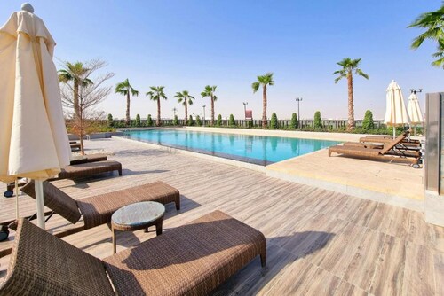 Exquisite 4BR Townhouse at DAMAC Hills 2 Victoria by Deluxe Holiday Homes