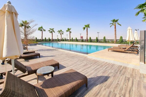 Pool - Exquisite 4BR Townhouse at DAMAC Hills 2 Victoria by Deluxe Holiday Homes (Dubai)