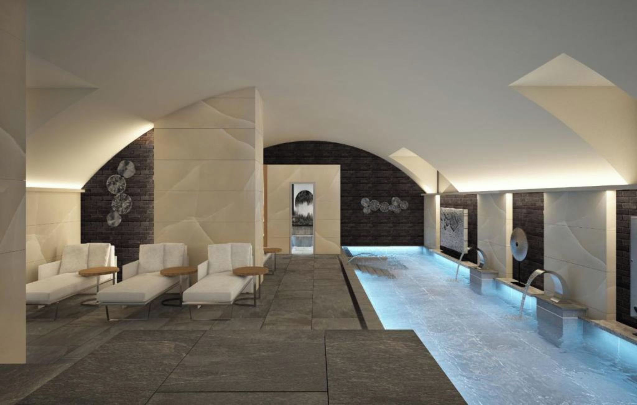 Uma área de spa com piscina, assentos e uma parede de pedra.