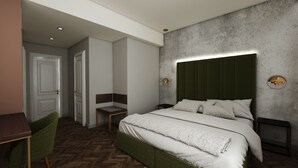 Ein modernes Schlafzimmer mit einem großen Bett, einem Schreibtisch und einem Stuhl.