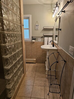 Shower, hair dryer, towels, soap